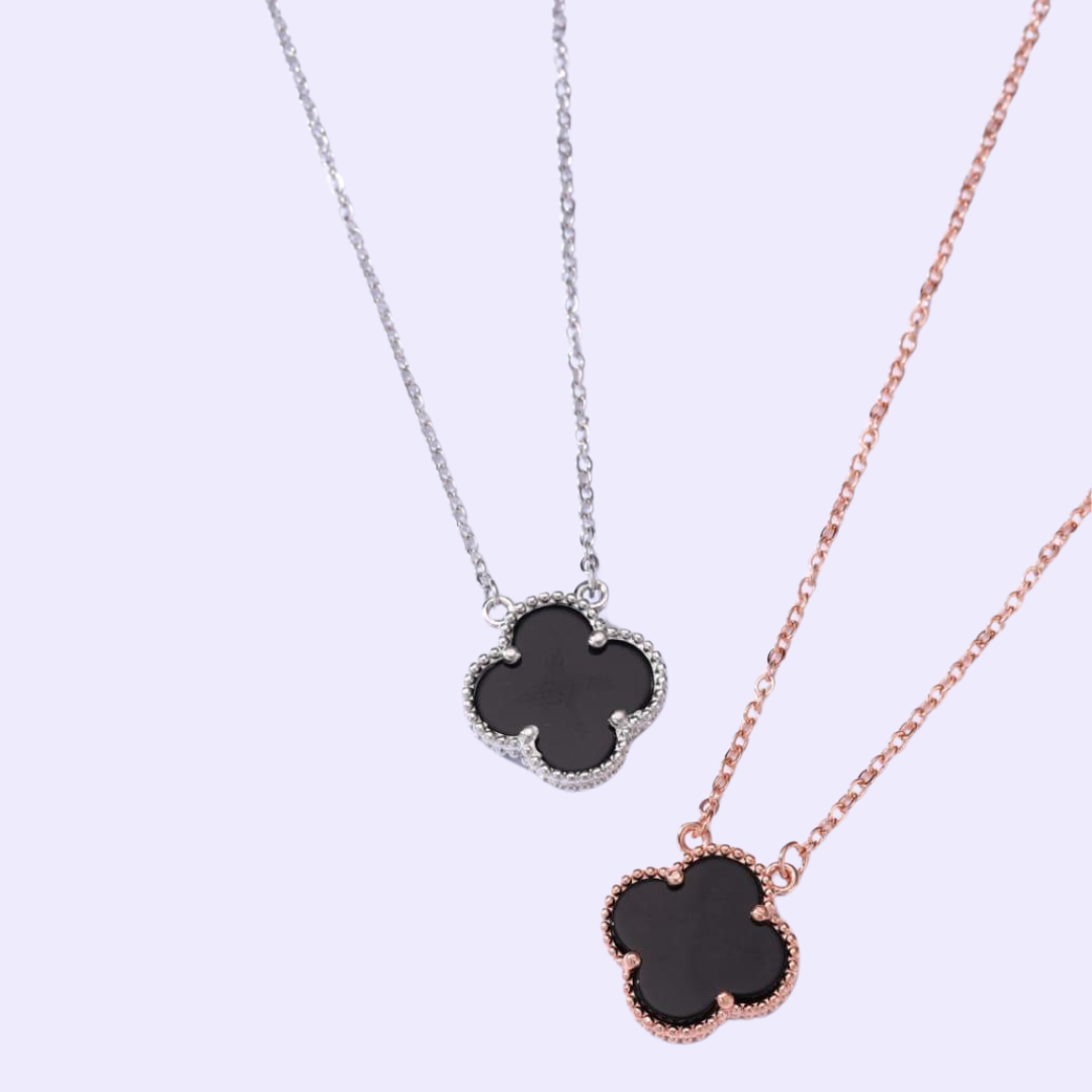 Alt text: Black flower Elegance Necklace with a black stone flower pendant on a silver chain.